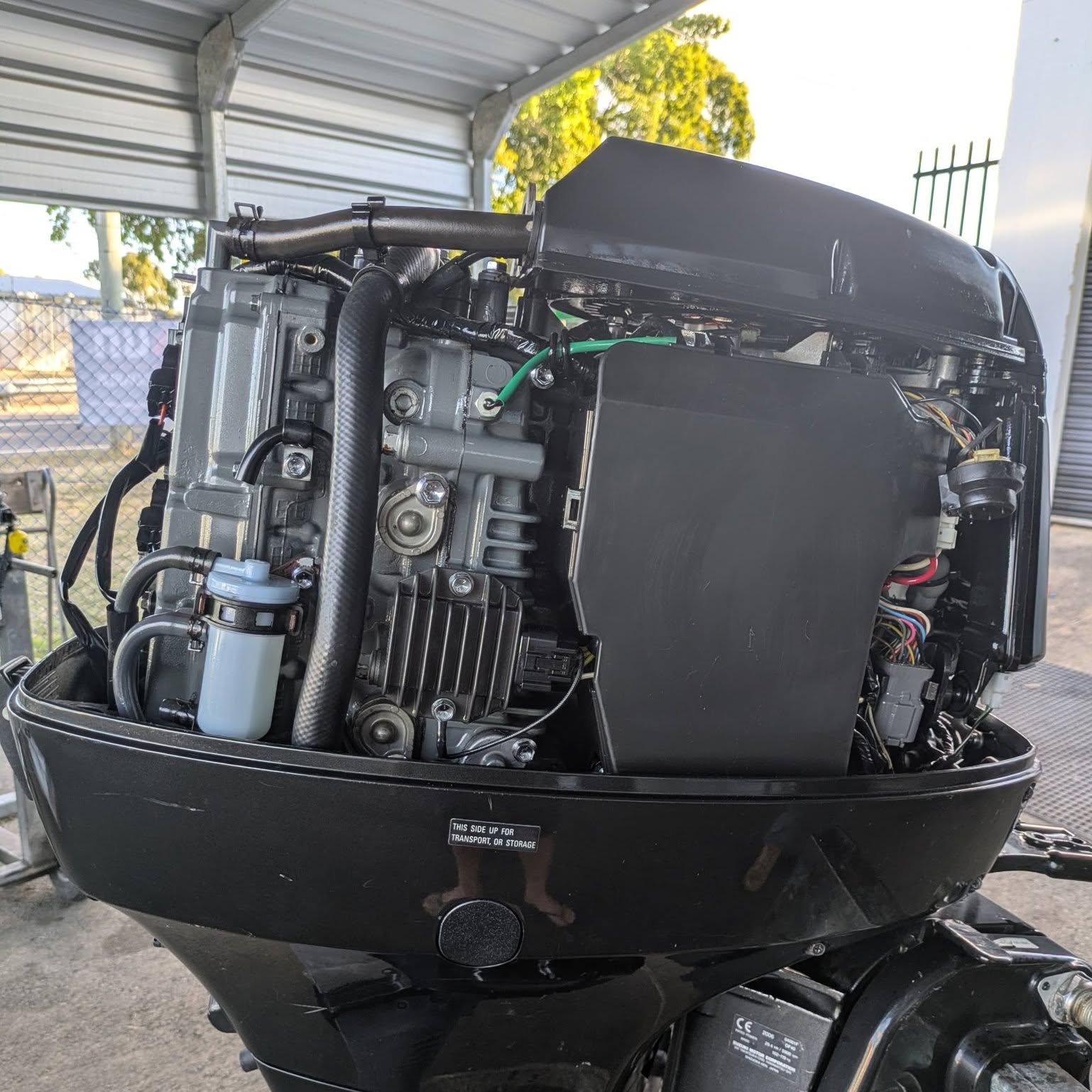 A four stroke outboard opened up with the engine internals visible
